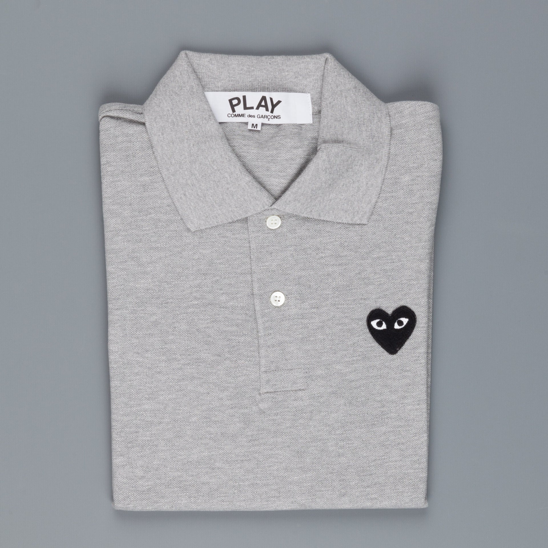 comme des garçons play polo shirts